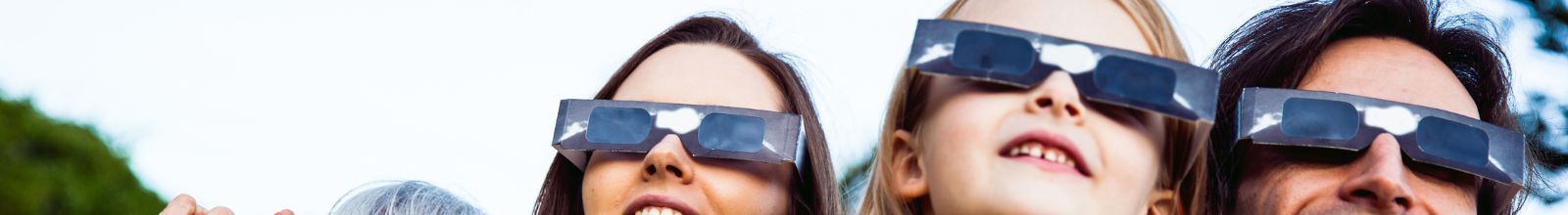 woman wearing safety glasses during Total Solar Eclipse