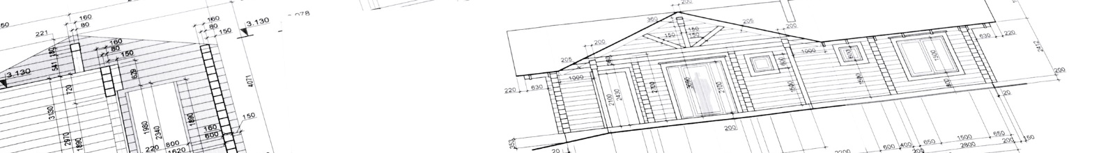 Building plans are sprawled out a table