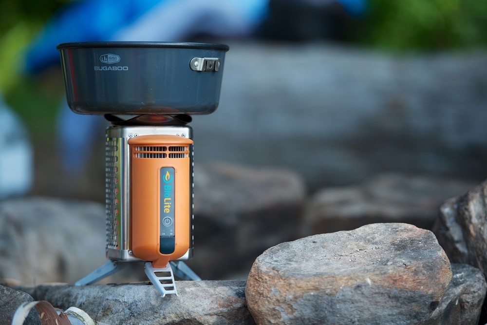 A small cooking pot hooked up to a biomass burner