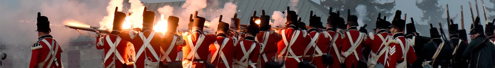 Re-enactment soldiers shooting muskets at Old Fort Erie 