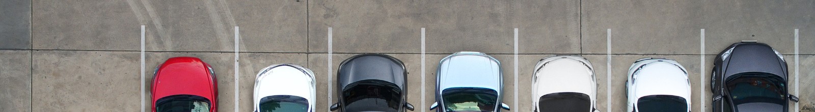 A row of cars parked in a line 