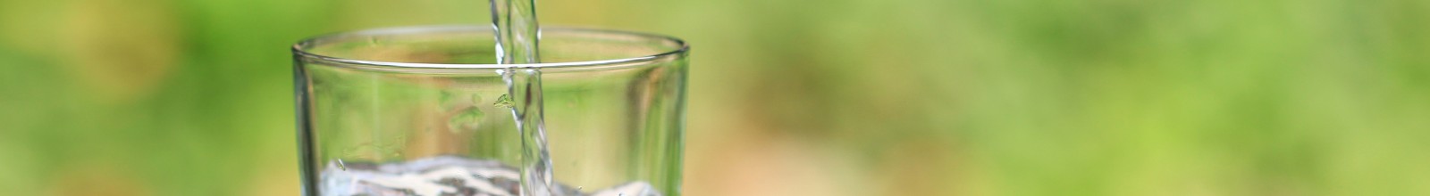 A glass being filled with water