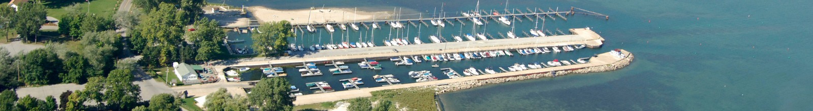 A large line of boats tied off to docks on Lake Erie