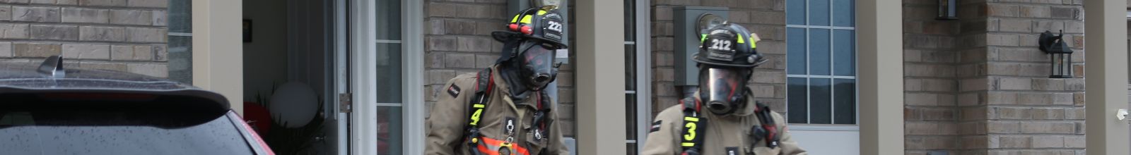 Two people in fire fighter gear