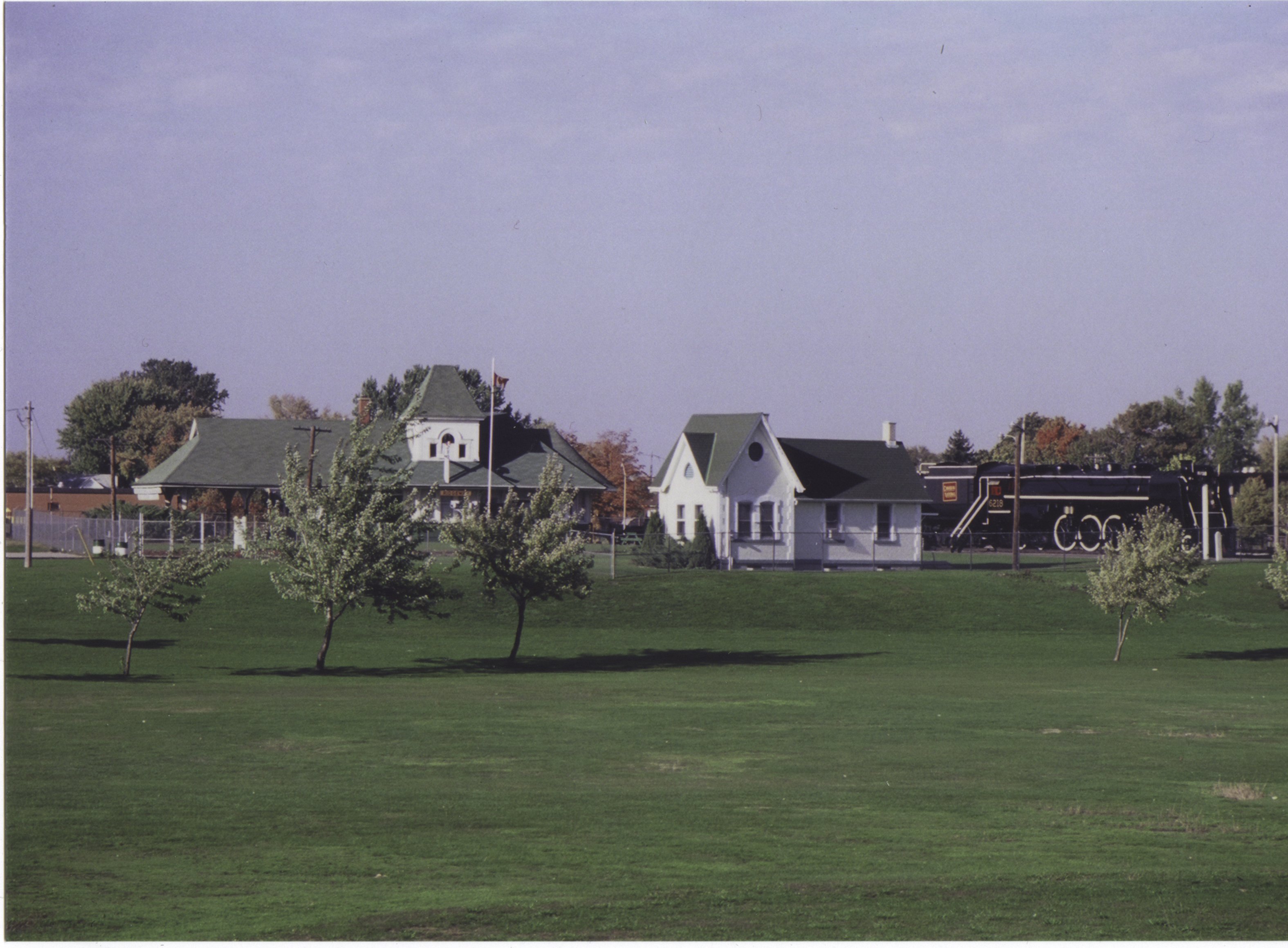 Two buildings with a historic train