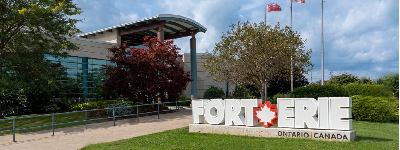 A large building with a big lettered sign out front that says Fort Erie