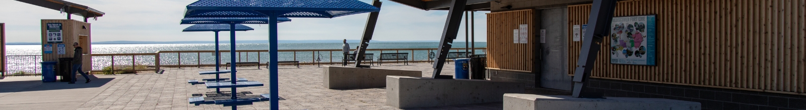 A sitting area with tables and benches