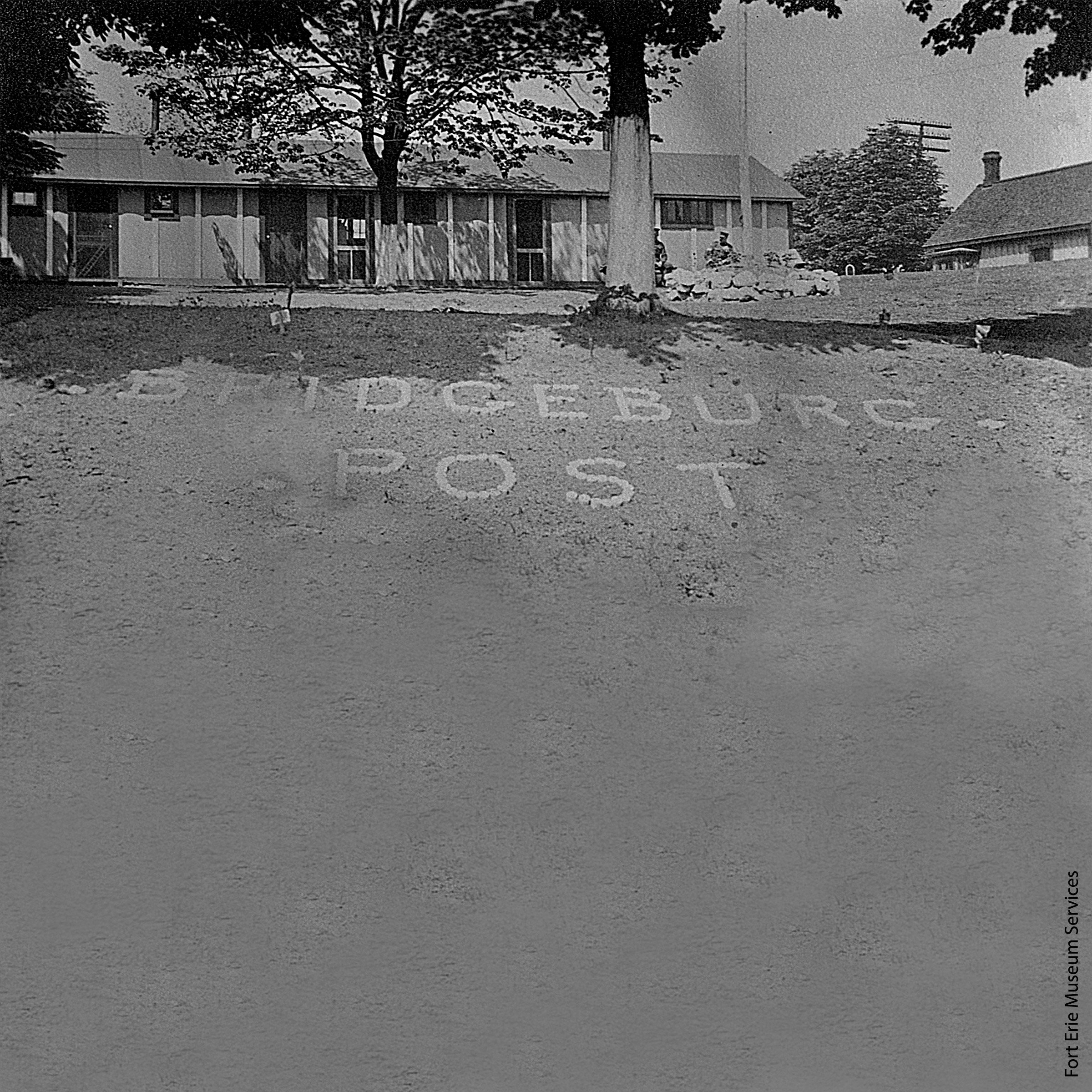 A house sitting right next to a sandy beach.