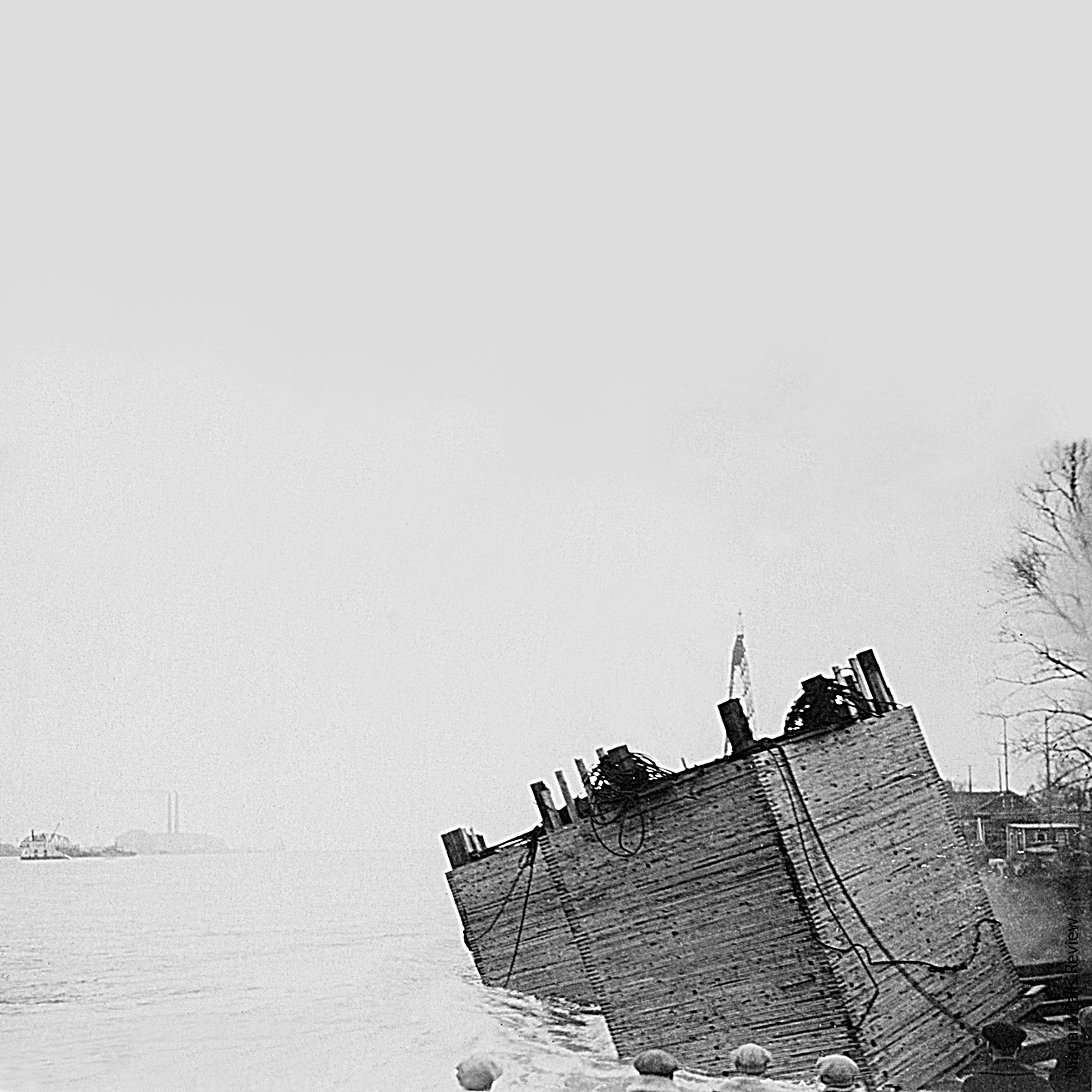 A large boat next to a lake