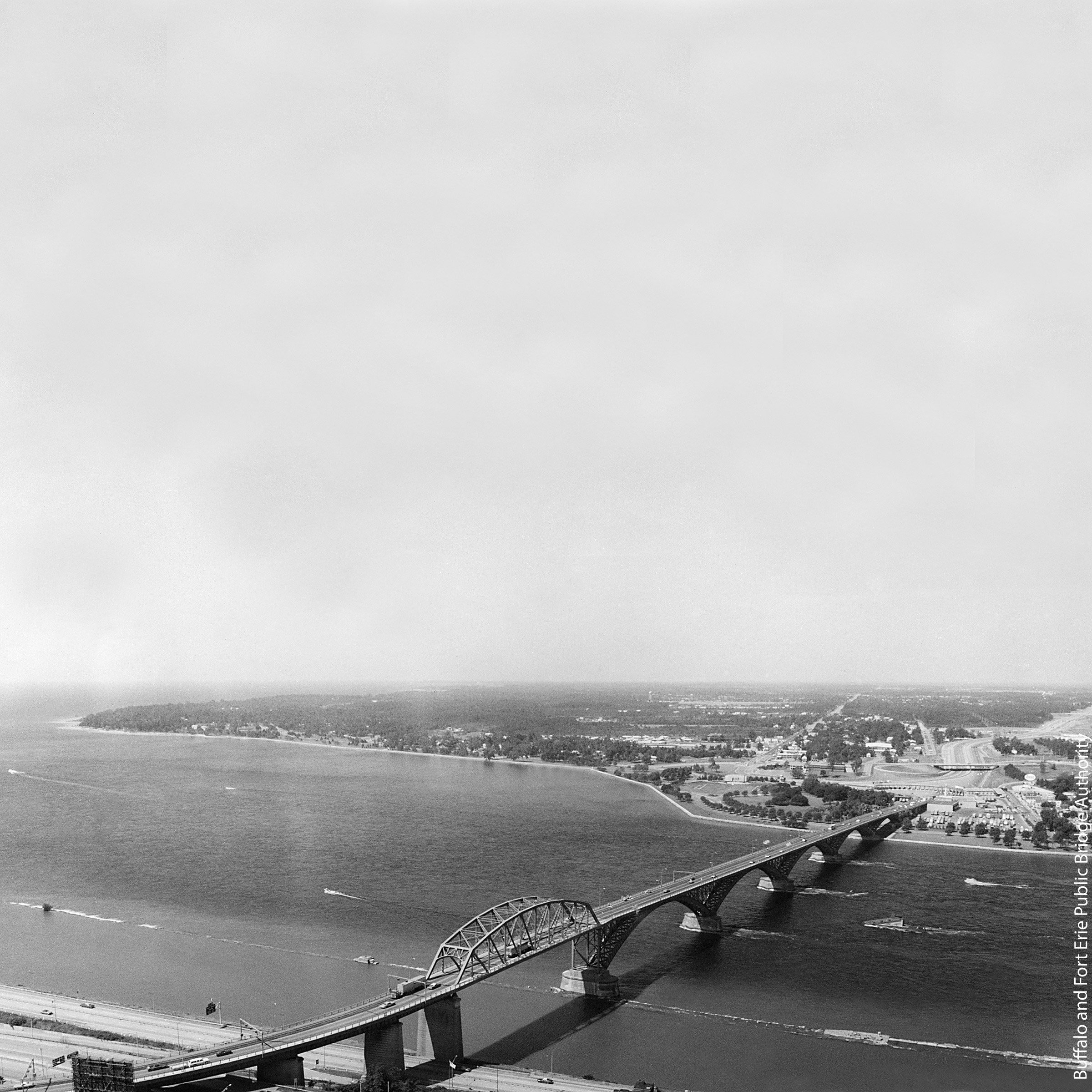 A large bridge over a large lake connecting two countries
