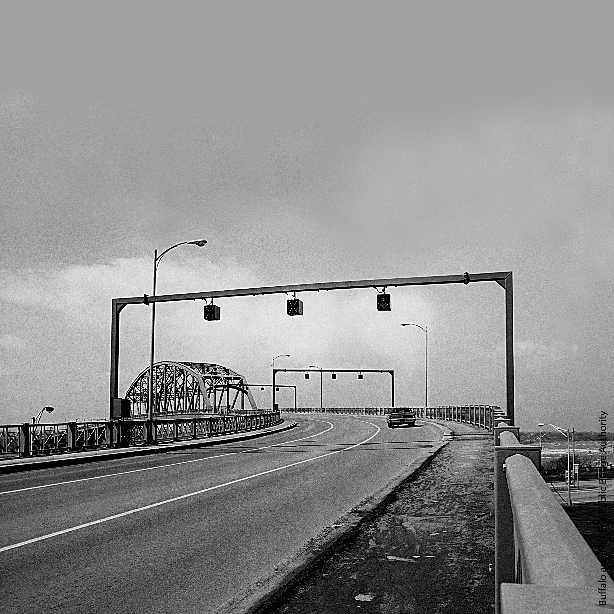 A sidewalk under construction on a large bridge