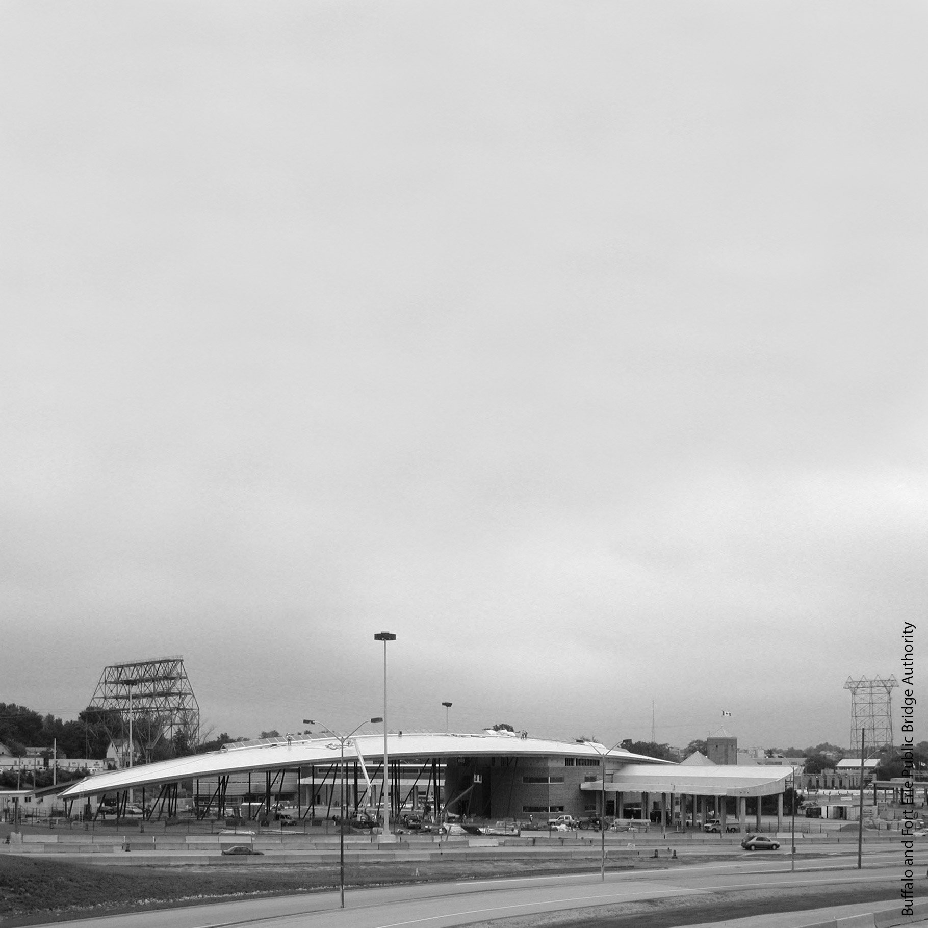A large building with booths coming off the side of it.