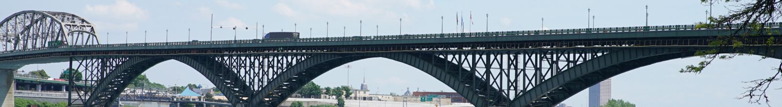 A large bridge crosses over a large river