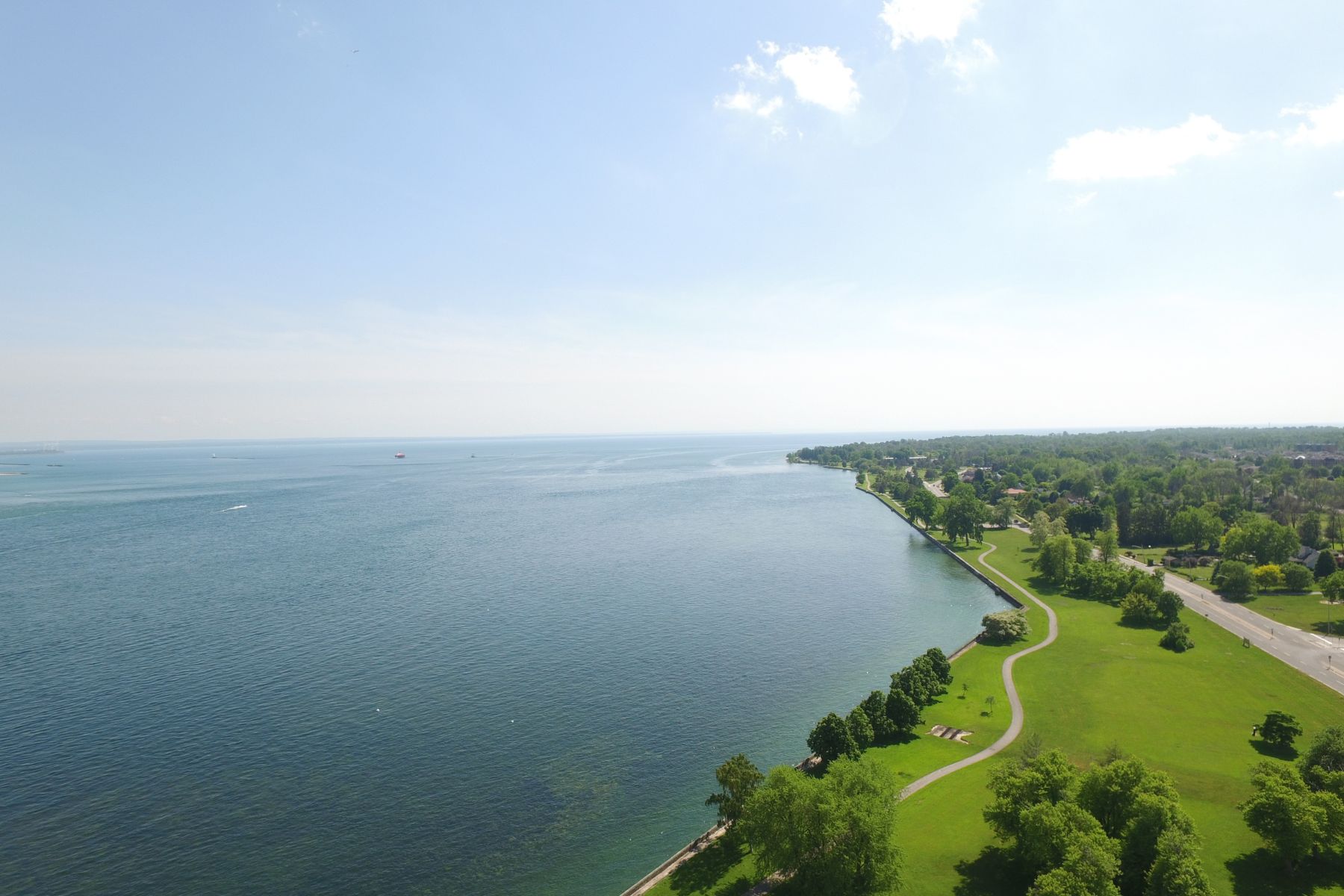 A large lake with a shoreline running into the distance