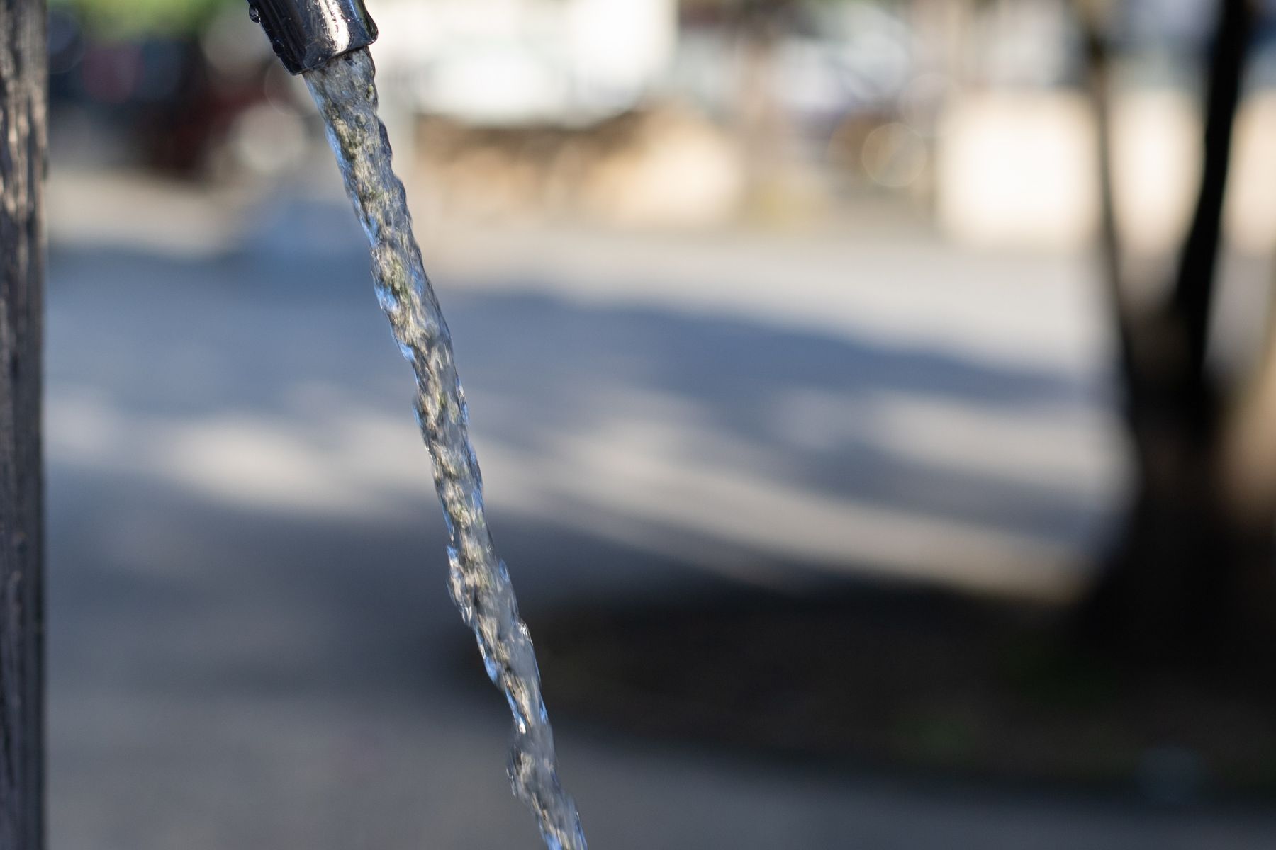 A stream of water runs our of a spout