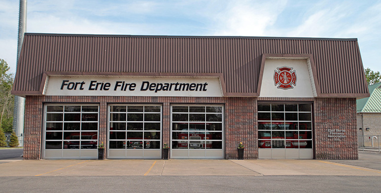 A large building with four bay doors