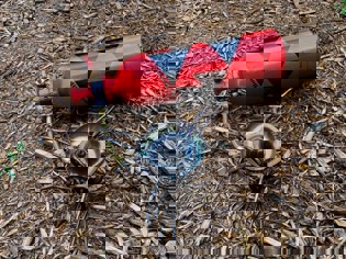 A tank is hooked up to a small burner