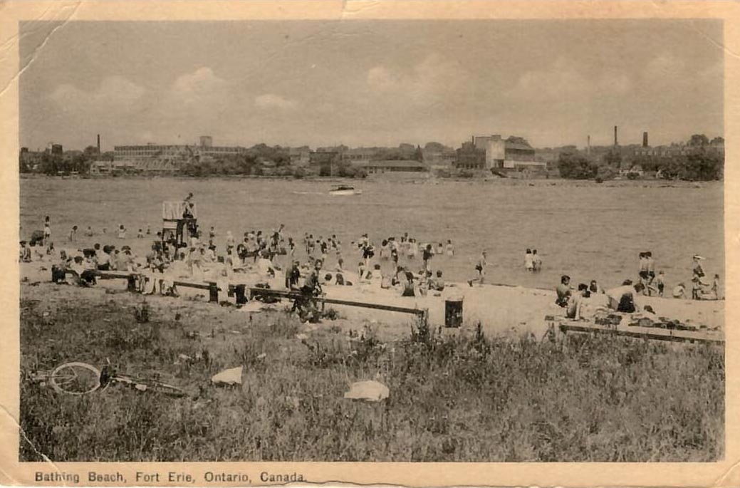 A beach with people swimming